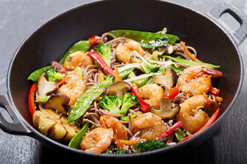 Sticker - Stir fried noodles with shrimps and vegetables in a wok