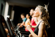© BGStock72 - young people running on treadmills in modern gym
