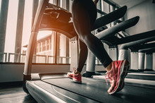 Close Up On Shoe,Women Running In A Gym On A Treadmill.exercising Concept.fitness And Healthy Lifestyle