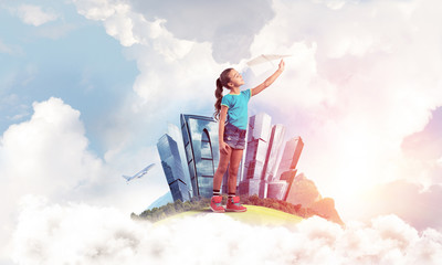 Wall Mural - Concept of careless happy childhood with girl dreaming about future