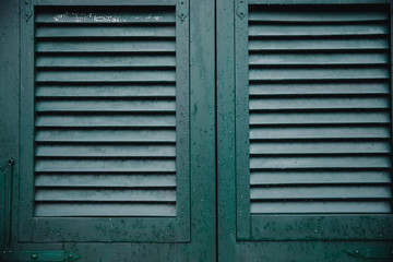 Green window shutters wooden dark vintage, blocking sunlight