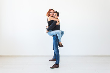 Wall Mural - Romantic, passion, people concept - young couple dancing with passion on white background with copy space