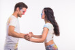 © satura_ - Holiday, social dance, holi and people concept - Happy couple having fun with multicolored powder on their faces and dancing bachata or kizomba on white background