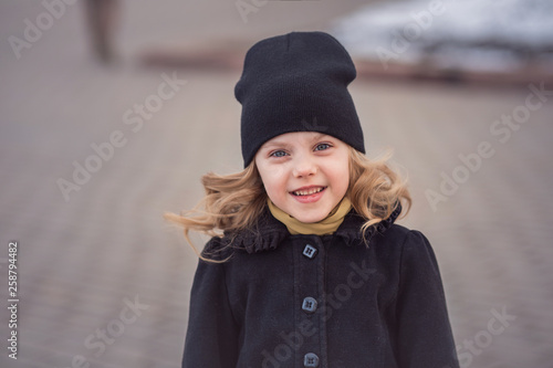 Child Little Cute Girl 7 Years Old In A Black Hat And Black