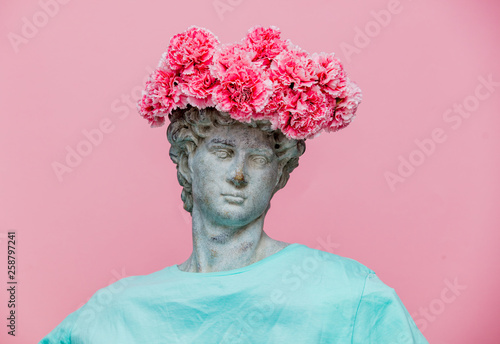 Antique bust of male with carnations bouquet in a hat Fotobehang
