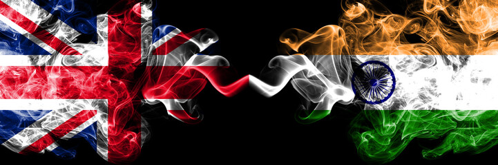 Wall Mural - United Kingdom vs India, Indian smoky mystic flags placed side by side. Thick colored silky smoke flags of Great Britain and India, Indian.