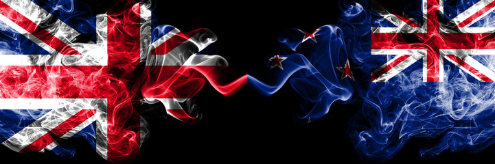 United Kingdom vs New Zealand, New Zealander smoky mystic flags placed side by side. Thick colored silky smoke flags of Great Britain and New Zealand, New Zealander.