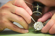 © Seventyfour - Macro close up of unrecognizable man repairing mechanical watch, copy space