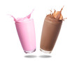 Strawberry milk and chocolate milk splashing out of glass isolated on white background.