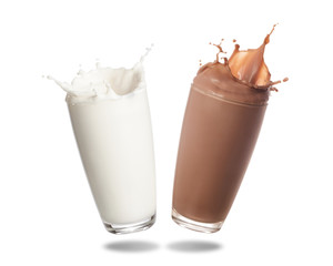 Wall Mural - Milk and chocolate milk splashing out of glass isolated on white background.