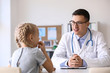 © Pixel-Shot - Pediatrician with little girl in his office