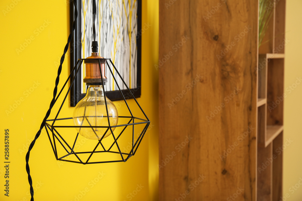 New lamp hanging on wall in interior of room