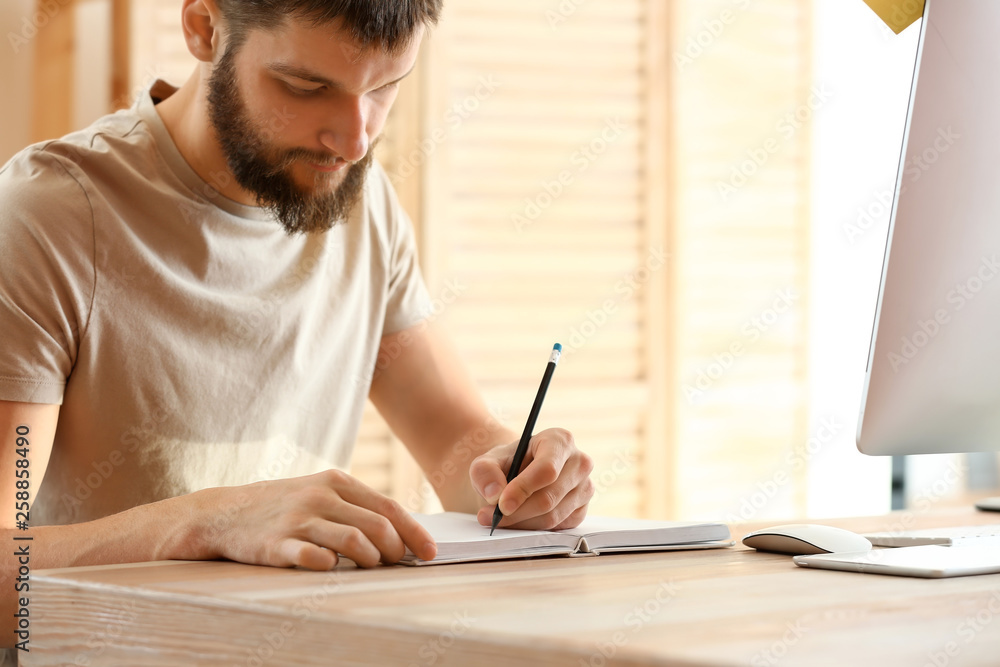 Male designer working in office