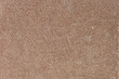 Fragment of painted brown cement stone wall background