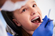 © gpointstudio - Girl with braces during a routine, dental examination
