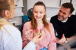 © gpointstudio - Girl choosing the color of rubber bands for braces
