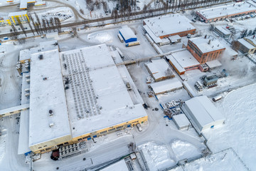 View of the urban industrial district from the air. Winter cityscape.