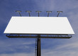 © pabijan - 3D rendering of blank billboard (empty advertisement) with clouds. Empty mockup template