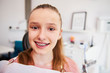 © gpointstudio - Portrait of smiling teenage girl with braces