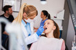 © gpointstudio - Focused orthodontist using dental mirror