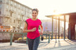 © Rido - Smiling woman jogging