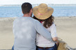 © auremar - rear view of mid adult couple looking at the sea