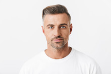 Image Of Confident Man 30s With Bristle Wearing Casual T-shirt Posing And Looking On Camera