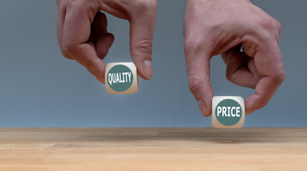 Symbol for choosing quality instead of a cheap price. Two Hands hold two dice with the words 