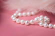 canvas print picture - Pearl necklace on a gently pink background