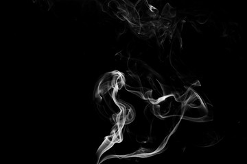 white smoke flame on a black background