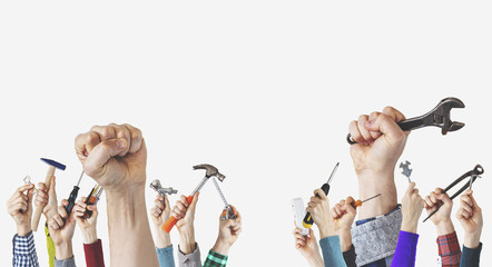 Building tool repair equipments, Labor Day photography concept, closeup of the raised fist of a young man