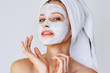 © Olesia - Beautiful young woman with facial mask on her face. Skin care and treatment, spa, natural beauty and cosmetology concept.