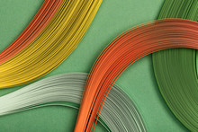 Close Up Of Yellow, Orange And Green Abstract Lines On Green Background