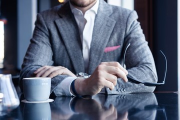 Canvas Print - Take a break and have coffee. Business man drinking coffee in a cafe.