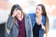 © Antonioguillem - Mad girl scolding her concerned friend