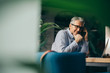 © cherryandbees - businessman using cellphone in cafe bar