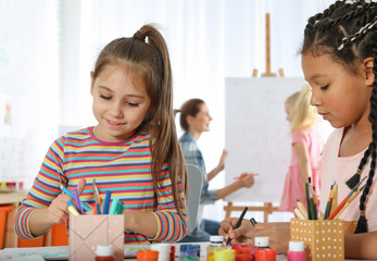 Poster - Cute little children drawing at painting lesson indoors