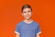 © Prostock-studio - Portrait of young boy on orange background