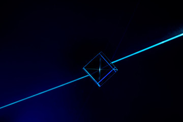 Laser beam and optical glass on black background