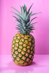 Raw pineapple on colorful background