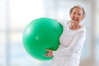 © JPC-PROD - Senior Woman with fitness ball in gym.