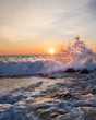 Waves crashing on the rocky shore at sunrise in Ocean City, MD. Photo by: Chuck Beyer