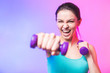 Close-up portrait of young attractive happy woman in sport clothes with beautiful smile holding weight dumbbell doing fitness workout isolated on white background in healthy lifestyle concept