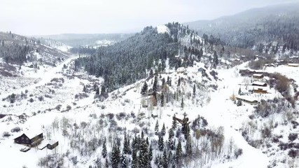 Affiche - Aerial view of rural mountain community in the Winter.