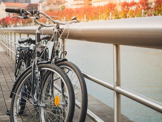 Wall Mural - Bicycles park in town city beside river view Europe travel