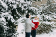 © wolfhound911 - Happy Couple Having Fun Outdoors in Snow Park. Winter Vacation