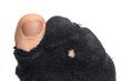 Sock with a hole and finger sticking out of them