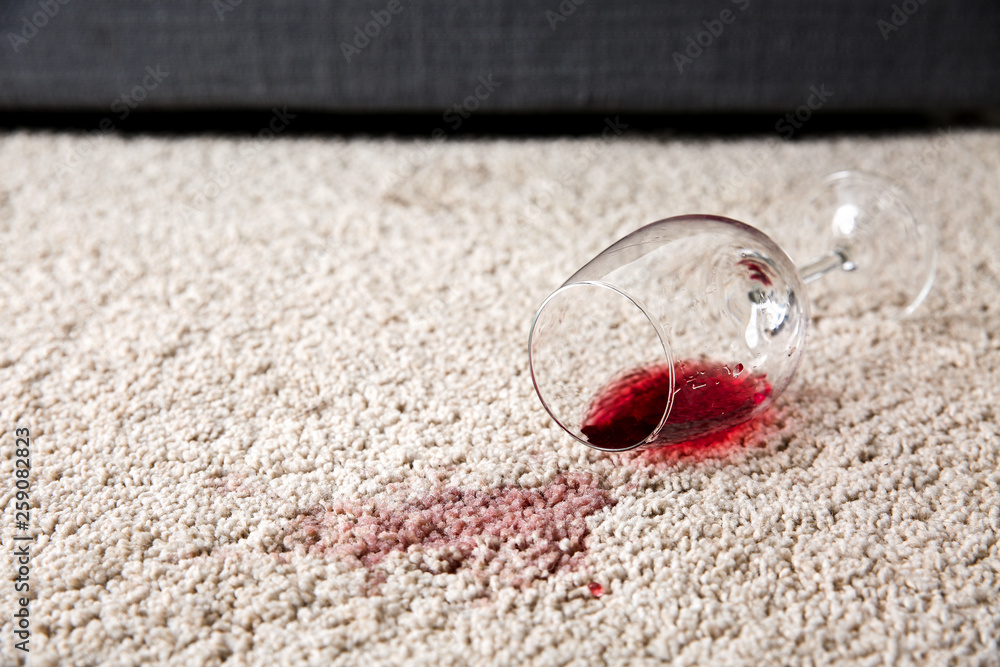 Glass of wine spilled on carpet