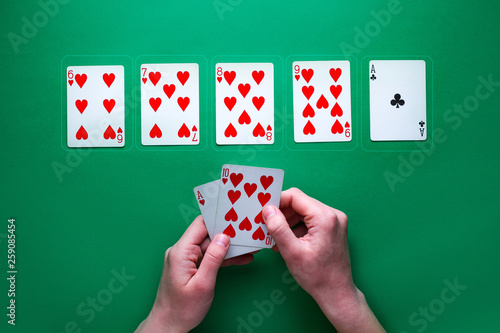 Cuadros en Lienzo Player at the table playing and showing cards at poker game