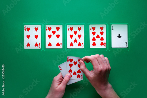 Cuadros en Lienzo Player at the table playing and showing cards at poker game